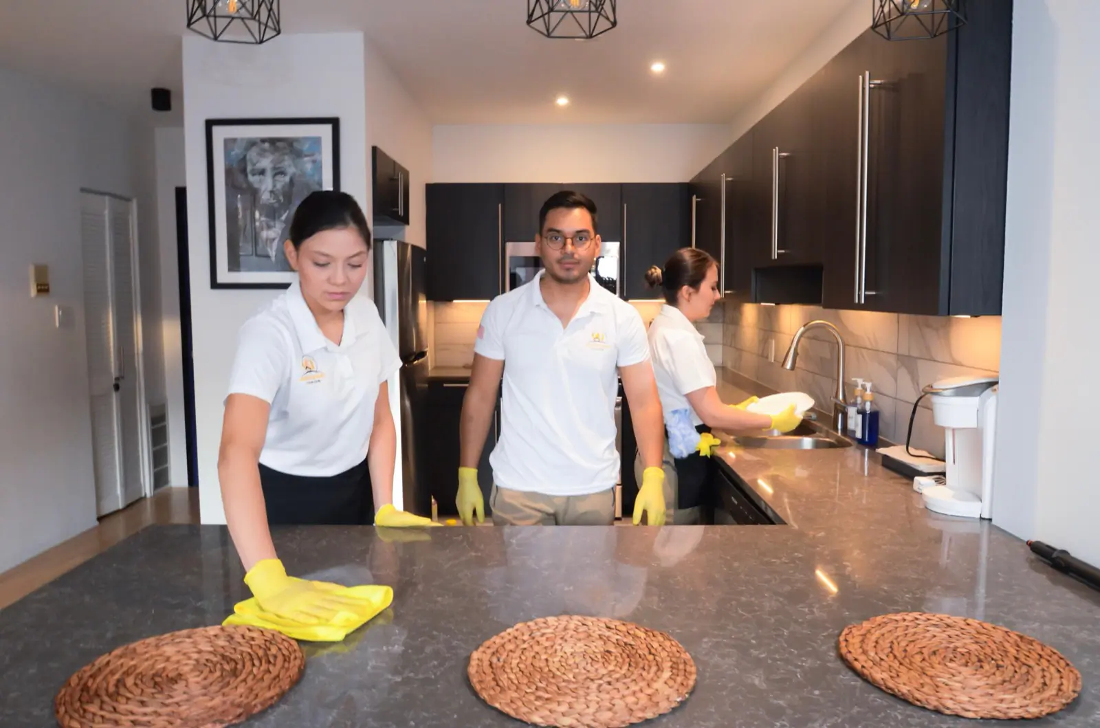 Awesome Cleaning team posing in a clean Chicago kitchen